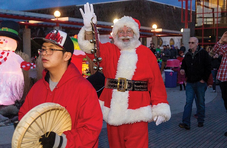 Citizen Photo by James Doyle. Nusdeh Yoh Drummers lead Santa Claus into Canada Games Plaza on Sunday afternoon as part of the 26th Annual Civic Light Up.