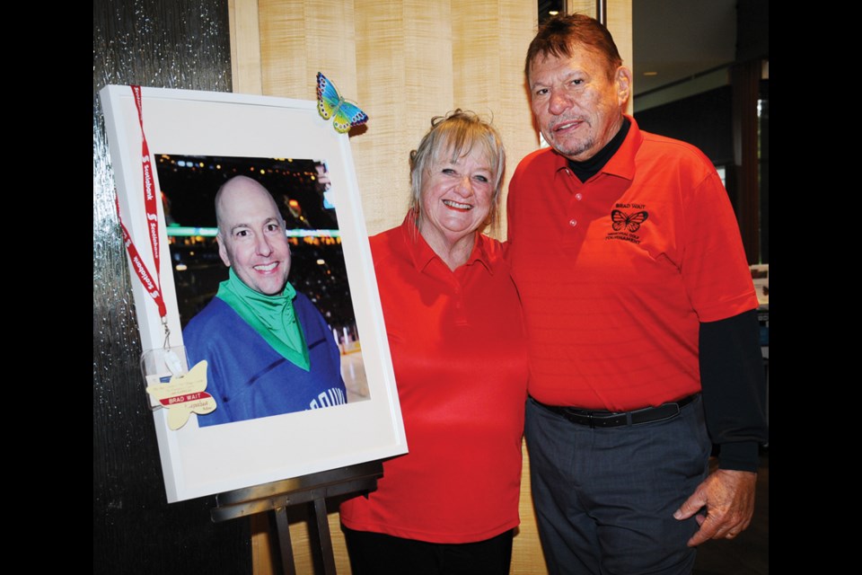 Helen and Rick Wait with a portrait of their son Brad.