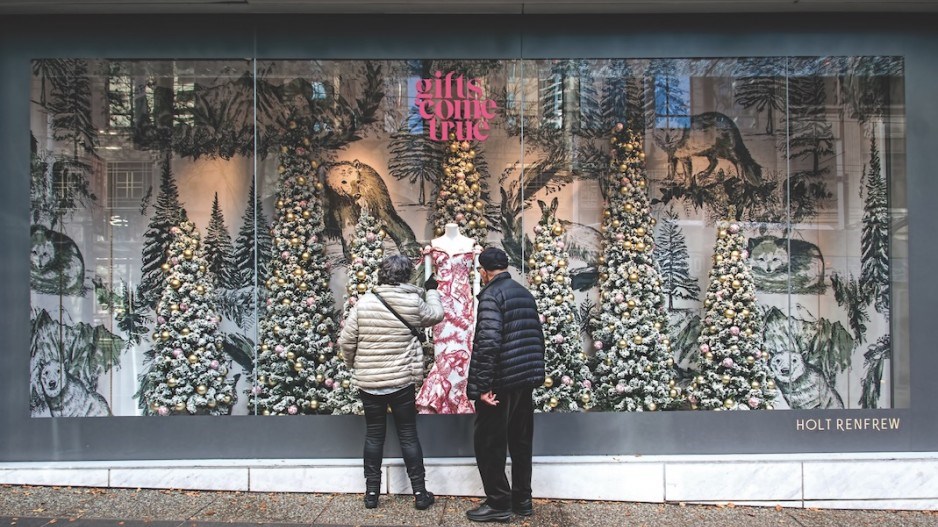 Shoppers enjoy the holiday-season windows outside Holt Renfrew in Vancouver. Photo Chung Chow