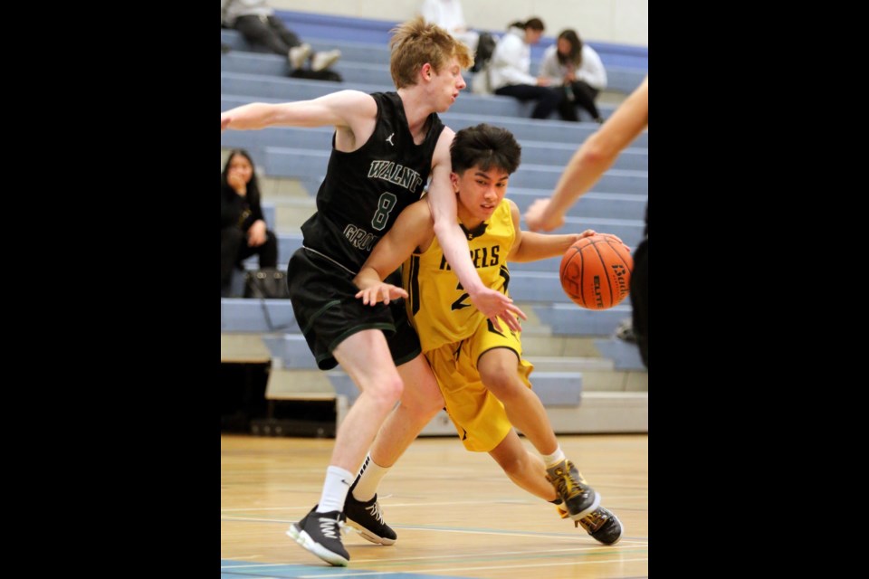 Burnaby South's Justin Sunga drives the lane against Walnut Grove's Greg Brown in the second half of their opening round game at the ninth annual Kodiak Klassic senior boys basketball tournament, Thursday at Centennial secondary in Coquitlam.