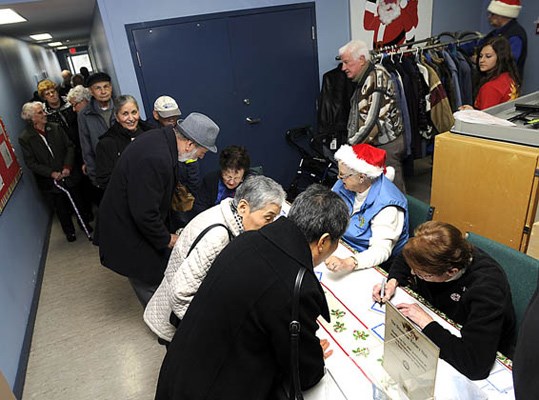 The Rotary Club of Steveston held their sixth annual Christmas lunch for seniors on Saturday at the Steveston Community Centre. A full complement of 180 diners registered and were lining-up almost an hour before the doors were even open. The Rotary club and McMath Interact student volunteers were prepared to serve up almost 50lbs of turkey, good conversation and good cheer. The big elf himself, Santa, dropped by for a brief visit to double-check on his naughty-and-nice list.