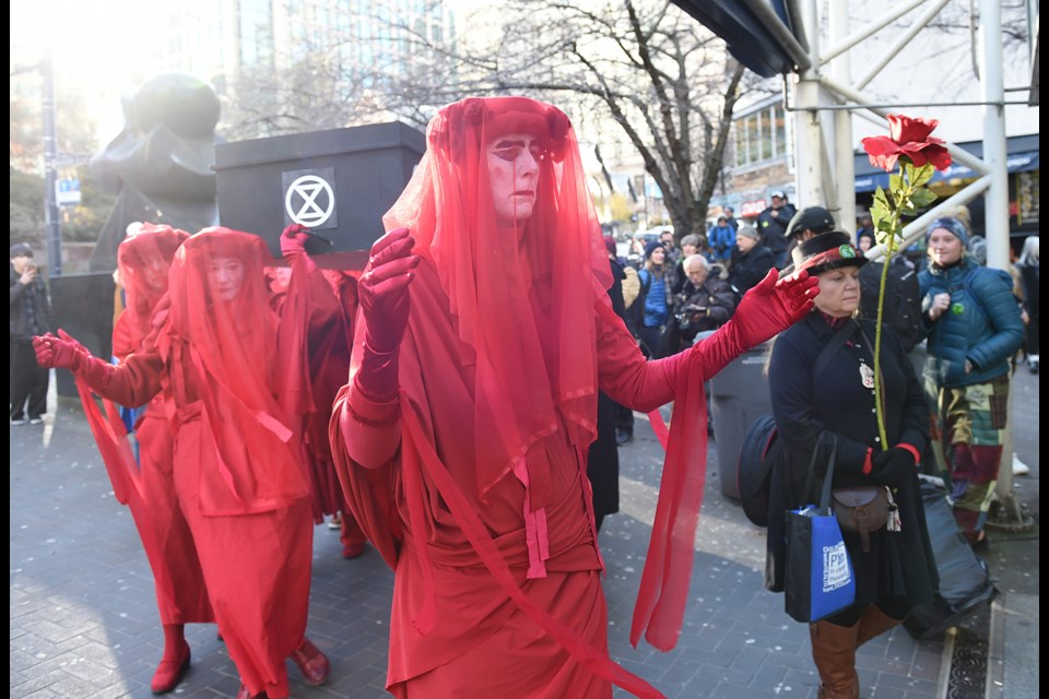 Extinction Rebellion Vancouver staged a funeral procession and wake for the planet downtown Friday afternoon. Photo Dan Toulgoet