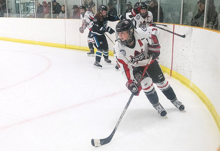 Citizen Photo by James Doyle. Northern Capitals forward Brette Kerley looks to make a play with the puck against the Vancouver Island Seals on Friday evening at Kin 2.