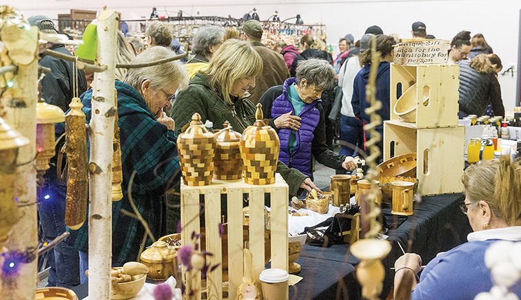 Citizen Photo by James Doyle. Shoppers check out some homemade crafts for sale on Saturday afternoon at Kelly Road Secondary School during the 34th annual Kelly Road Craft Fair.