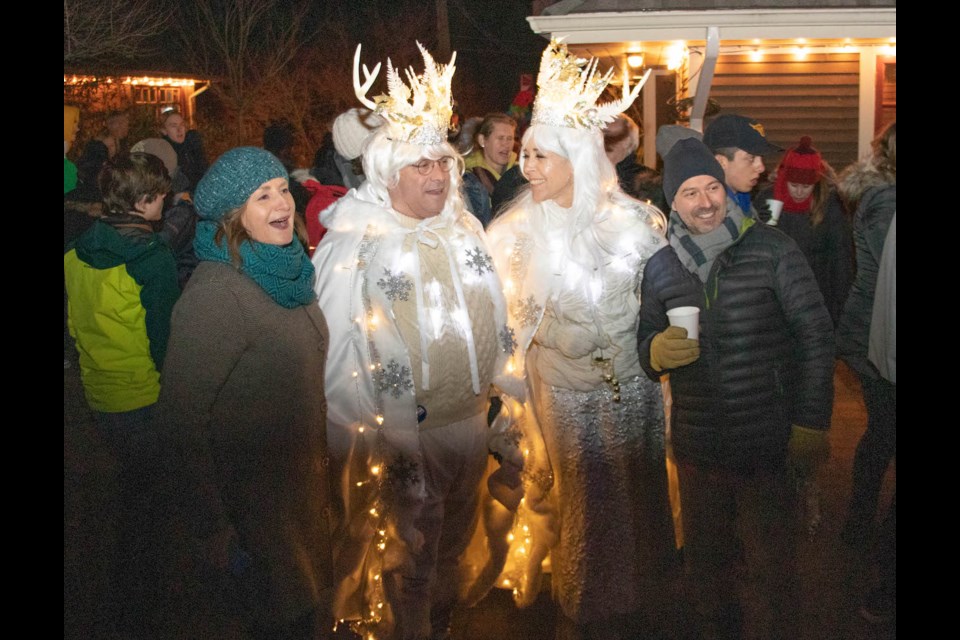 Julie Cree and Christophe Langlois pose with the snow king and queen as the festivities begin.