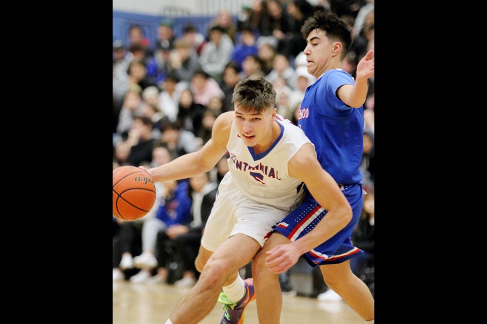 MARIO BARTEL/THE TRI-CITY NEWS
Centennial Centaurs foward Paul Didenko drives around Semiahmoo defender Maddox Budiman in the first half of their opening round game at the Kodiak Klassic senior boys basketball tournament, last Thursday at Centennial secondary.