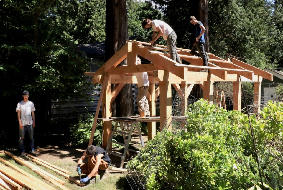 West Vancouver Secondary students build the frame of the B.I. Museum and Archives’ new arbour