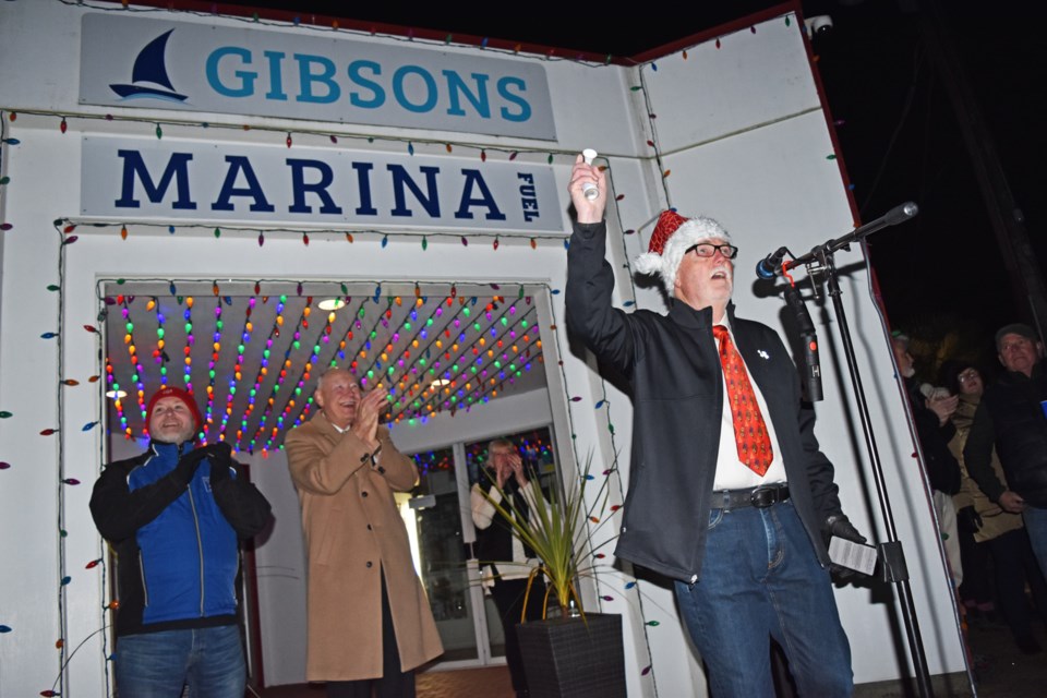 Mayor Bill Beamish sounds the air horn at Gibsons Marina last Friday.