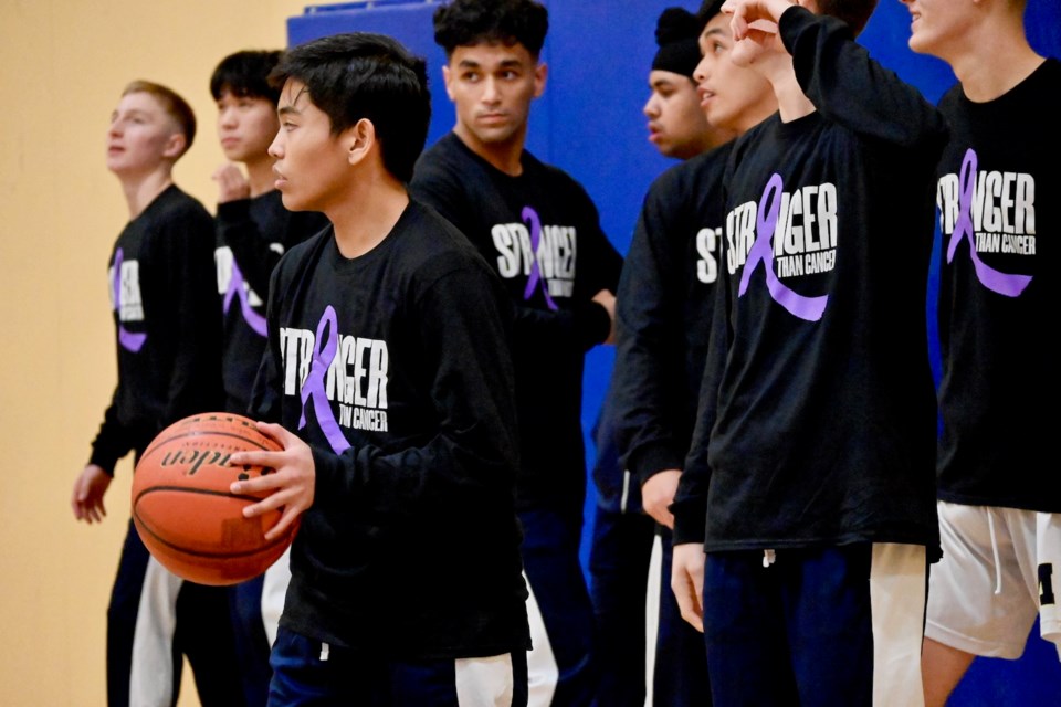 MacNeill Ravens senior boys basketball team wore special warm-up tops for their sixth annual Stronger Than Cancer night on Monday. The evening raised over $2,000 for the B.C. Cancer Foundation.