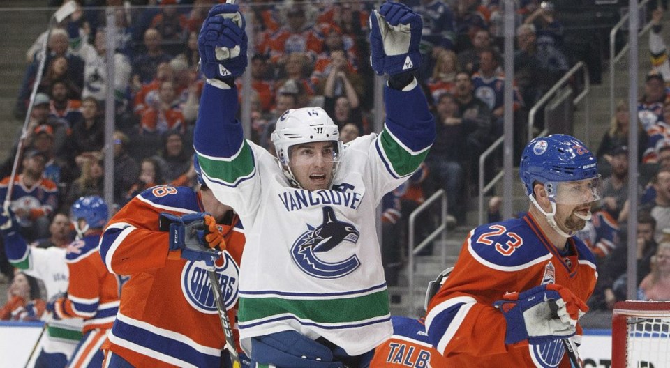 Alex Burrows celebrates a goal for the Vancouver Canucks against the Edmonton Oilers.