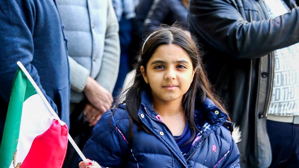 A young girl takes part in protests in front of the Vancouver Art Gallery Sunday, Nov. 24