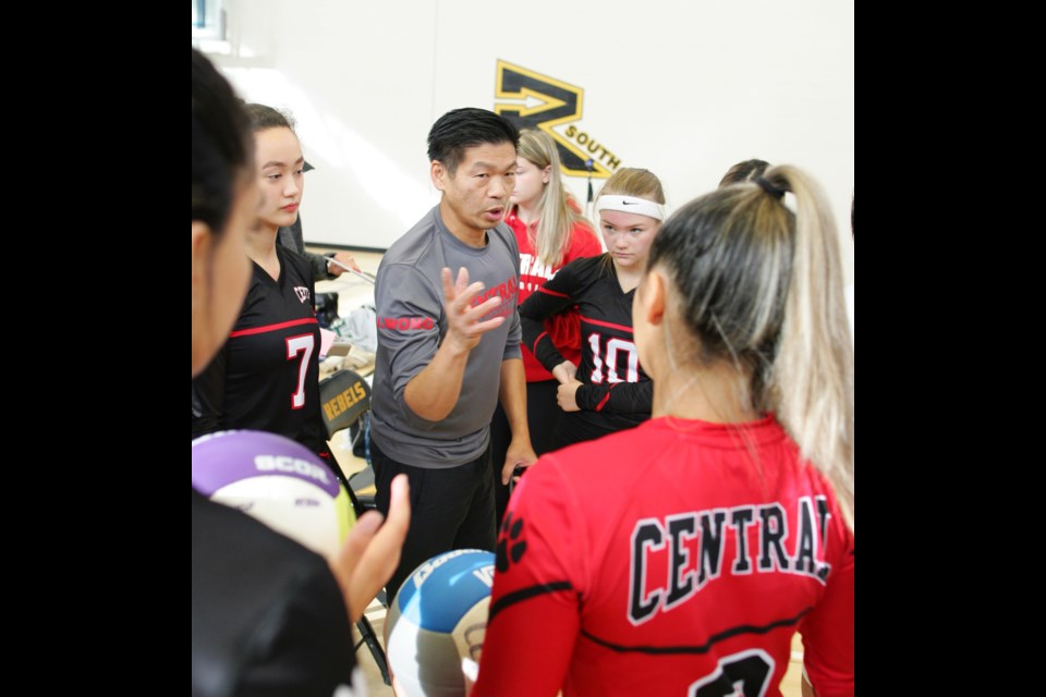 Burnaby Central Wildcats assistant coach John Wong talks strategy with the team during a tournament earlier in the season. The Wildcats captured twin banners this year en route to finishing 11th at the provincials last week.