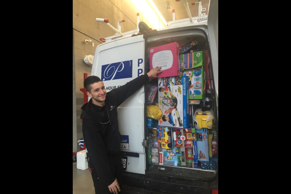 A truck is filled with gifts and toys donated by local residents. Nono Shen photo