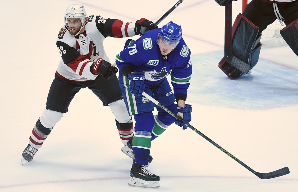 Micheal Ferland battles for space in front of the net in the Canucks 2019 preseason.