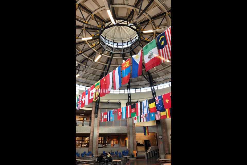 Maria said as she walked into McMath Secondary, she was immediately confronted by 54 national flags hanging from the ceiling of the school’s hallway. Photo submitted
