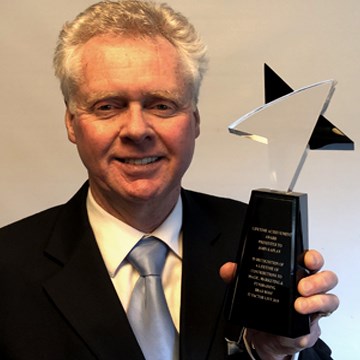 Richmond magician John Kaplan, with his Lifetime Achievement Award. Photo submitted