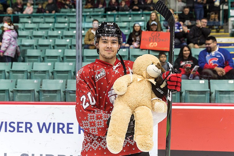 Citizen Photo by James Doyle. Prince George Cougars player Ilijah Colina was the 2019 Teddy and Toque Toss goal scorer on Saturday night at CN Centre.