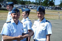 Flight sergeant Emily Poon shakes hands with Colonel Benninger after receiving her Air Cadet Wings.