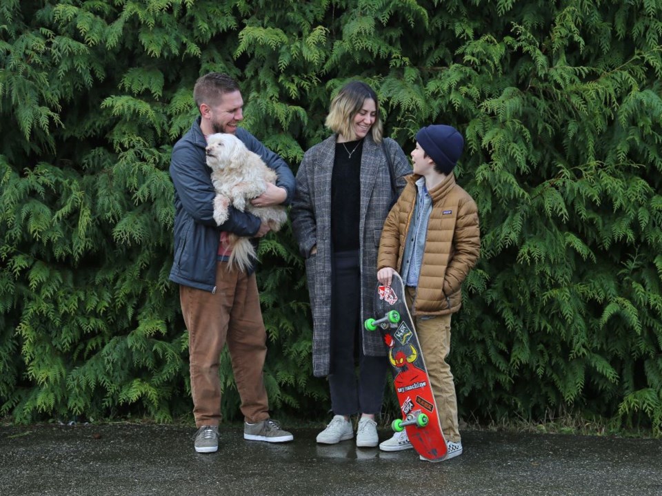 Vancouver Is Awesome founder Bob Kronbauer with dog Frankie, his wife Kate and son Arlo at their new