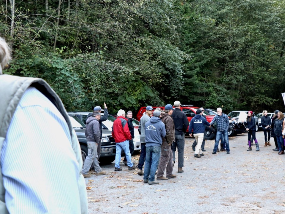 The volunteer firefighters greet supporters after chief Derek Dickson agrees to step aside Oct. 10