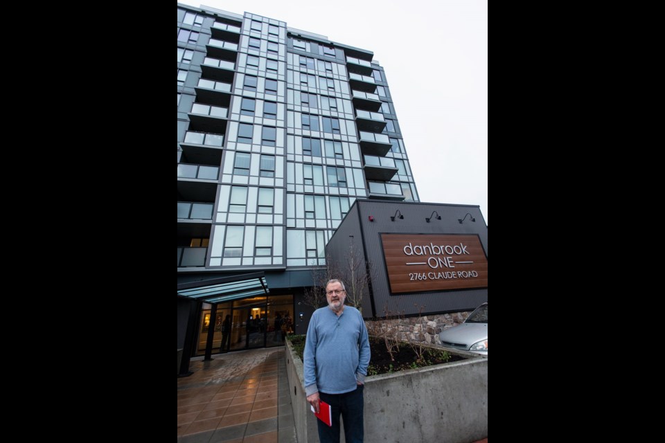 Resident Bob Breuker in front of Danbrook One at 2766 Claude Rd. in Langford.