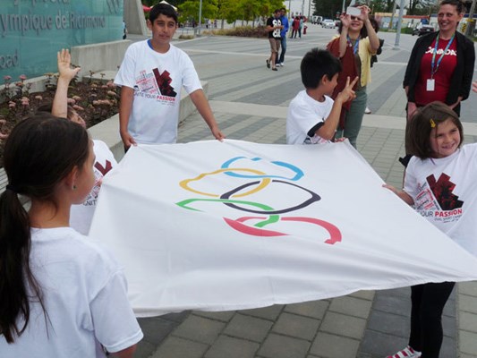 Summer camp kids held their own flag-raising ceremony at the oval to mark the start of the London 2012 Games.