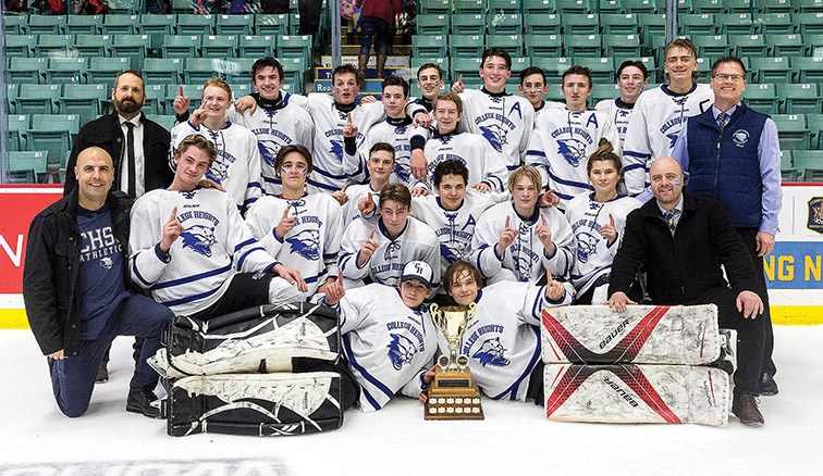 College Heights Cougars players and coaches pose for a group photo after winning the Spirit of Hockey & Community Cup Friday afternoon at CN Centre at the 17th Annual Spirit Hockey Game.