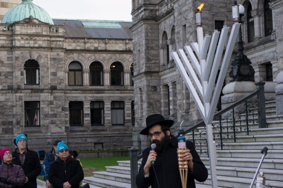 Rabbi Meir Kaplan, outside the B.C. legislature on Sunday, prepares to light the first candle of the menorah to mark the first day of Hanukkah. Dec. 22, 2019