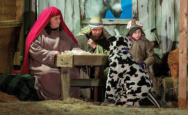 Citizen Photo by James Doyle. Mary, Joseph, and newborn Jesus take shelter in a stable on Sunday evening during College Heights Baptist Church’s Live Nativity.
