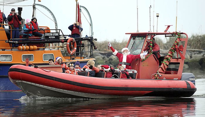 Kick-off to Christmas in Steveston began with hundreds lined up along Steveston Wharf awaiting Santa's arrival by boat. With RCMP escort and an entourage of elves, Santa led a procession of giddy and anxious kids to the Gulf of Georgia Cannery Museum where Santa heard each of their Christmas wishes. The day ended with Mayor Malcolm Brodie and his own entourage of dignitaries switching on the Steveston Christmas tree in front of the museum.