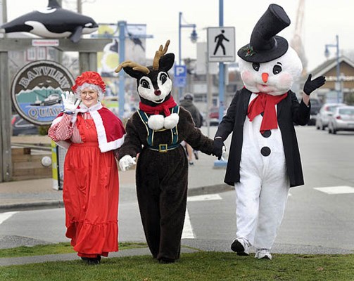 Kick-off to Christmas in Steveston began with hundreds lined up along Steveston Wharf awaiting Santa's arrival by boat. With RCMP escort and an entourage of elves, Santa led a procession of giddy and anxious kids to the Gulf of Georgia Cannery Museum where Santa heard each of their Christmas wishes. The day ended with Mayor Malcolm Brodie and his own entourage of dignitaries switching on the Steveston Christmas tree in front of the museum.