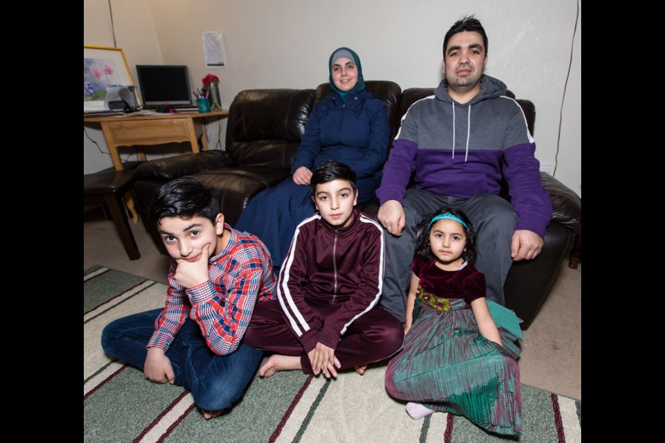 Parents Hanadi Kadadou and Osama Shelleh with their children, from left: Zaid, Abdul and Loujain. They came to Canada in 2015, fleeing the war in Syria. December 2019