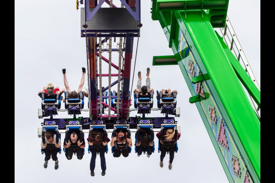 Saanich Fair patrons brave the new Frenzy swinging pendulum ride that made its debut on the midway this year.