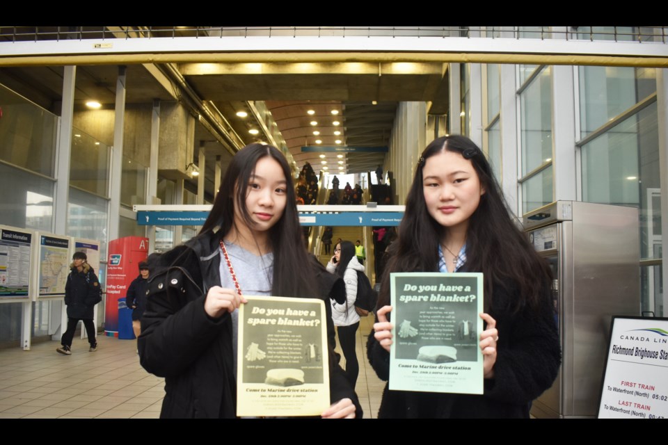 Yoshier Hu (left) and Sarah Lin (right) want to make sure more people have warmth during the holiday season. Nono Shen photo