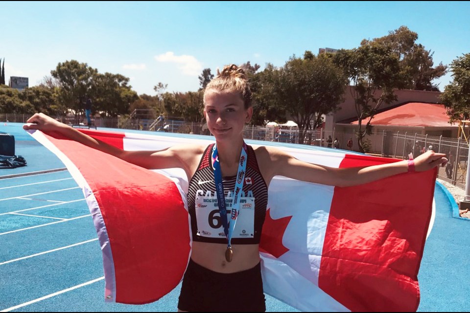 New West's Kate Stewart Barnett celebrates her gold medal victory for Canada at the u18 NACAC championships in Mexico.