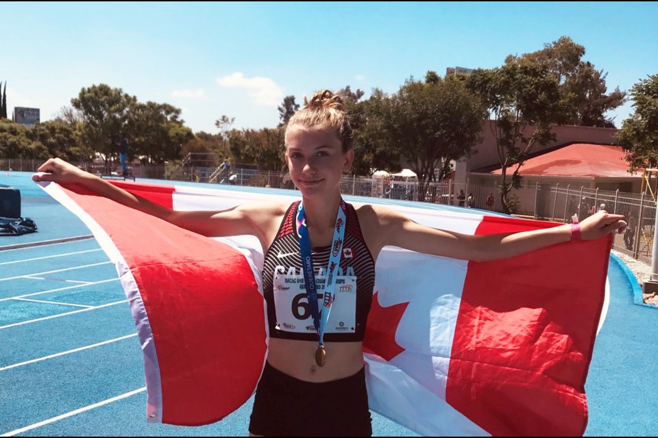 New West's Kate Stewart Barnett celebrates her gold medal victory for Canada at the u18 NACAC championships in Mexico.