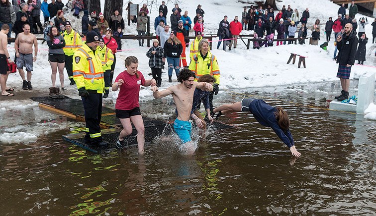 Citizen Photo by James Doyle. Dippers jump into the chilly water of Ness Lake on Wednesday afternoon while participating in Ness Lake Bible Camp’s 19th Annual Polar Bear Dip.