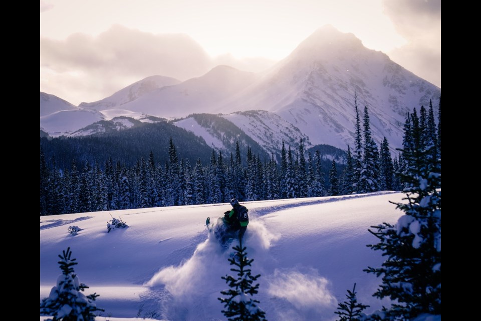 A snowmobiler enjoys riding in the Kakwa region of the North Rockies.