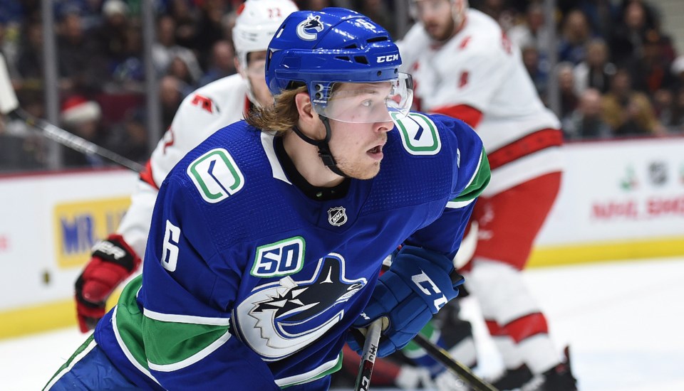 Brock Boeser carries the puck for the Vancouver Canucks in a game against the Carolina Hurricanes.