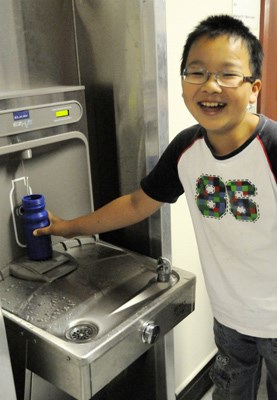Eddie Lin, a Grade 6 student at Ferris, uses the water filling station installed in January.