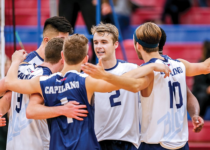 Fifth-year setter Simon Friesen (No. 2) of the Capilano Blues celebrates with teammates during a recent match. The Blues have loaded up with big blockers and power hitters as Friesen goes for PacWest gold in his final season. photo Paul Yates/Vancouver Sports Pictures
