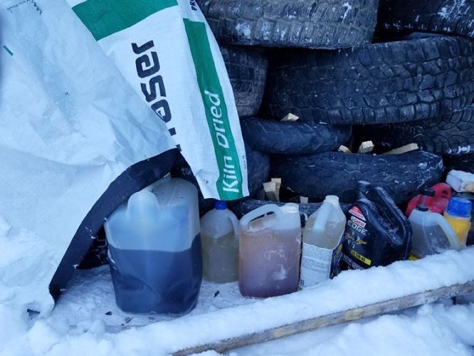 RCMP found jugs of gasoline,other accelerants and kindling under a stack of tires covered by tarps during a patrol on Morice West Forest Service Road on Jan. 6.