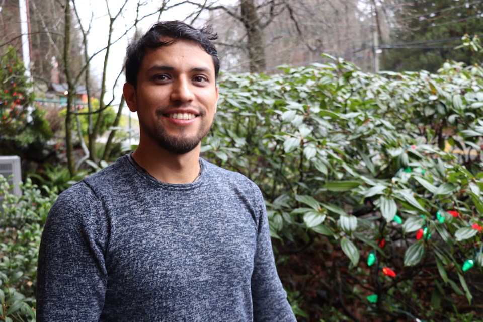 Gonzalez in front of greenery