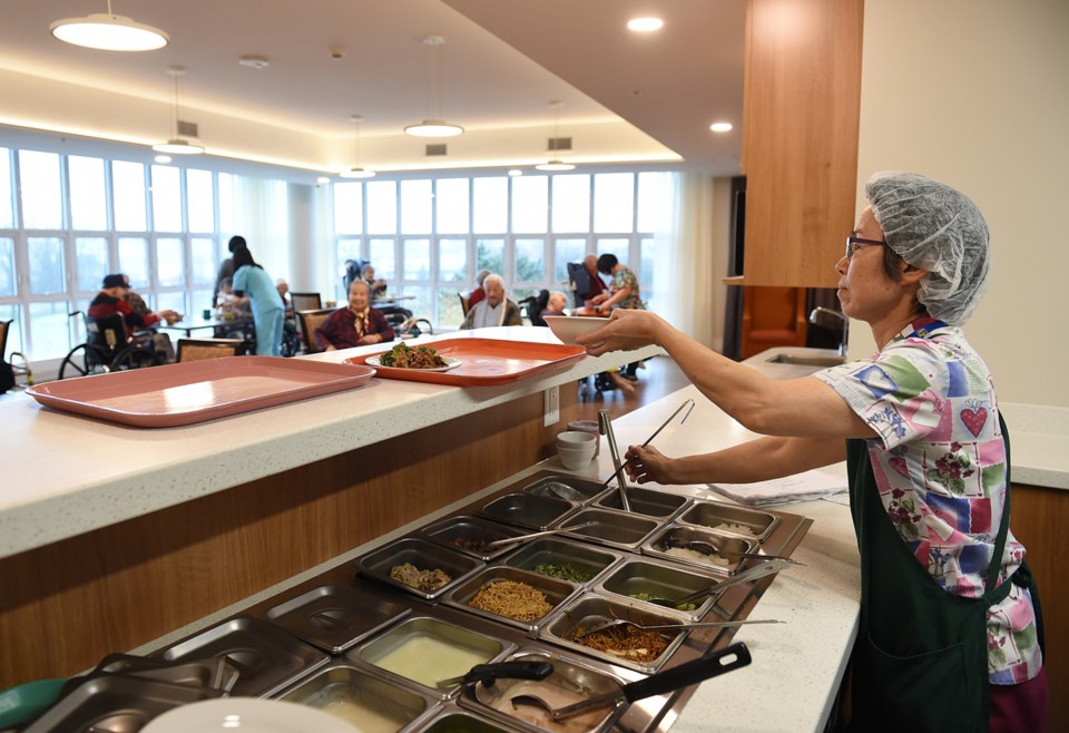 A staff member dishes out lunch. Each floor or 