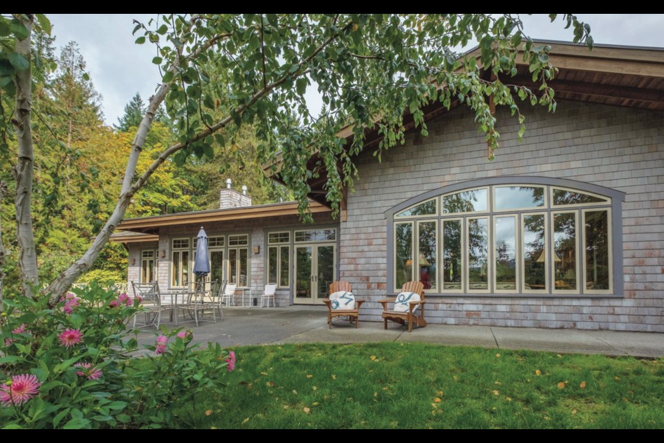 The south facing Mill Bay home has custom windows made by Loewen, and an Arts and Crafts, Prairie School vibe.
