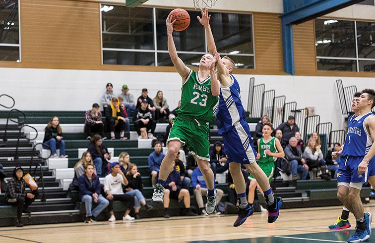 Citizen Photo by James Doyle. Kelly Road Roadrunners player Braeden Muise goes for a layup against the Charles Hays Rainmakers on Friday evening at PGSS gymnasium during the PGSS Polar Clash Sr. Boys basketball tournament.