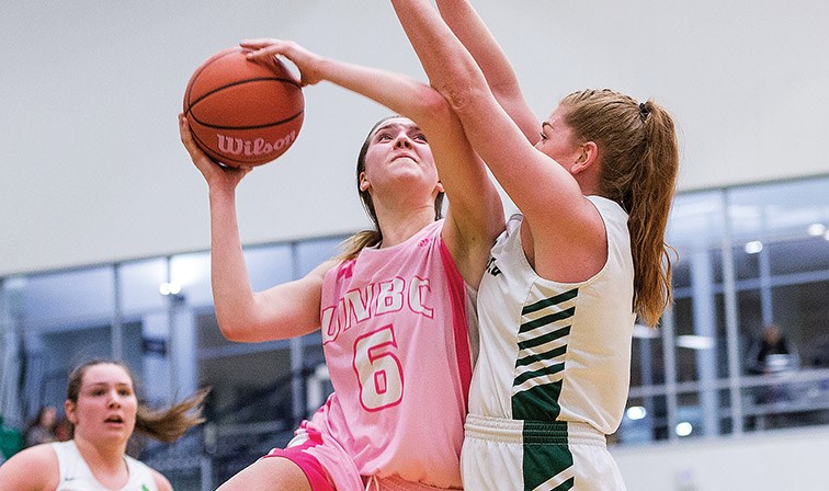 Citizen Photo by James Doyle. UNBC Timberwolves forward Madison Landry goes for a layup against University of the Fraser Valley defender Taylor Claggett on Saturday evening at Northern Sport Centre.