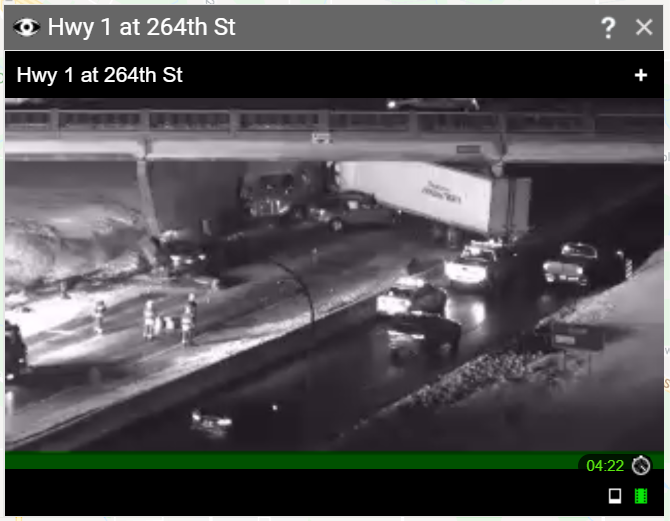 A jackknifed semi wedged under an overpass in Langley. Photo DriveBC