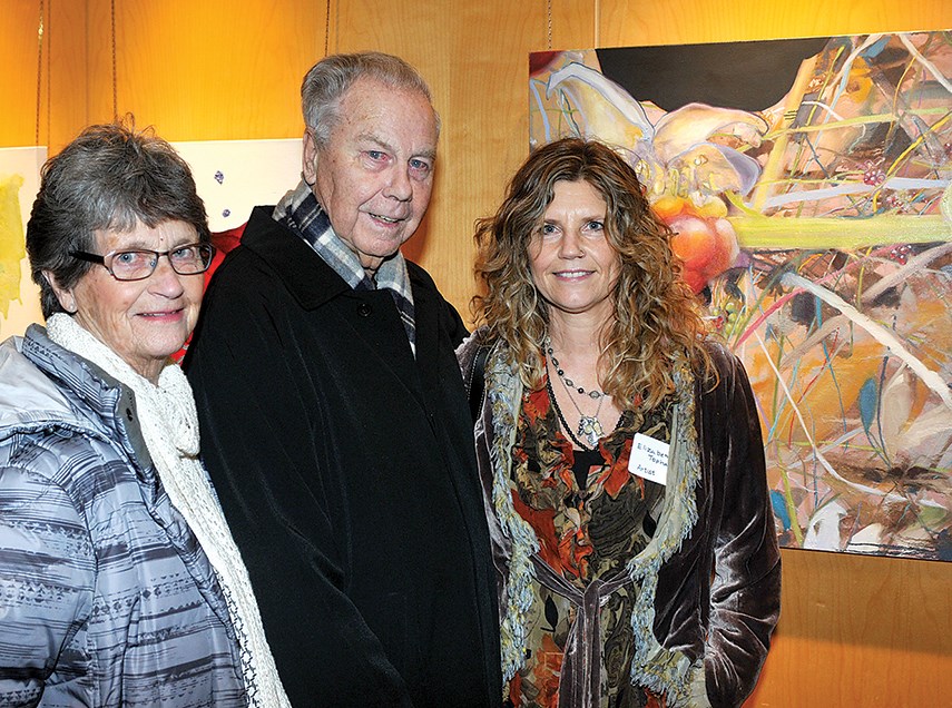 Exhibiting artist Elizabeth Topham with parents Wendy and Lorne Topham.