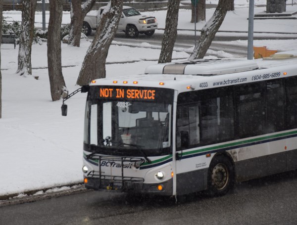 An out of service Sunshine Coast Transit bus passes through downtown Sechelt Jan. 15